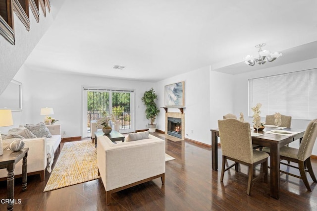 5036 Echo St Unit 37, Los Angeles, CA 90042 - living room featuring a fireplace with flush hearth, dark wood-style flooring, and a chandelier
