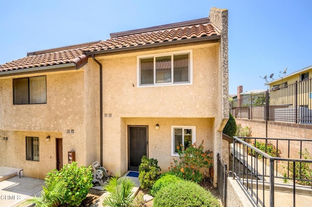 5036 Echo St Unit 37, Los Angeles, CA 90042 - view of front facade with a tile roof and stucco siding