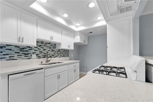 1477 Clemson Way, Riverside, CA 92507 - kitchen with dishwashing machine, gas range gas stove, ornamental molding, white cabinets, and backsplash
