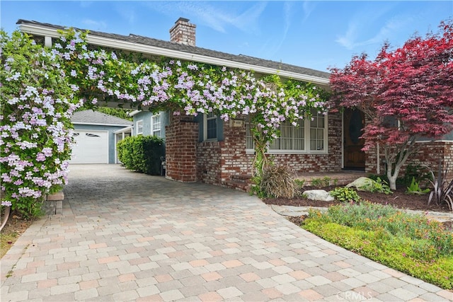 406 University Ave, Burbank, CA 91504 - obstructed view of property with a chimney, decorative driveway, and brick siding