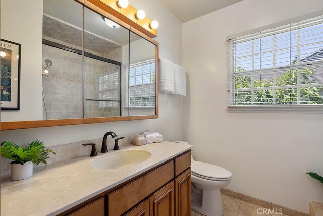 406 University Ave, Burbank, CA 91504 - bathroom featuring tile patterned flooring, vanity, and a tile shower