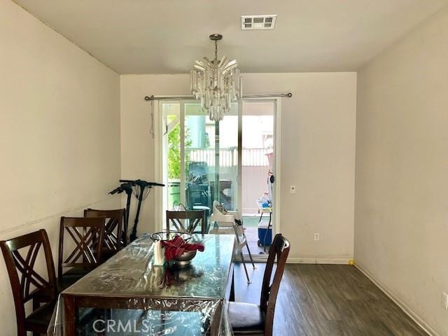 11 Lilac Ln, Compton, CA 90221 - dining area featuring a chandelier and wood finished floors