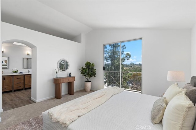 54 Hawaii Dr, Aliso Viejo, CA 92656 - carpeted bedroom with arched walkways, vaulted ceiling, and ensuite bathroom
