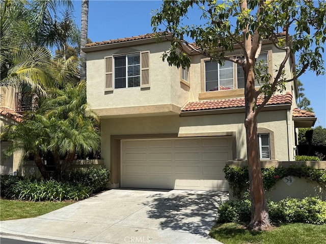 54 Hawaii Dr, Aliso Viejo, CA 92656 - mediterranean / spanish home with an attached garage, stucco siding, concrete driveway, and a tile roof