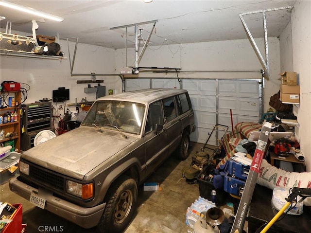 3687 Madison Dr, Clearlake, CA 95422 - garage featuring a garage door opener
