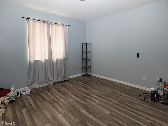3687 Madison Dr, Clearlake, CA 95422 - spare room featuring dark wood-type flooring and baseboards