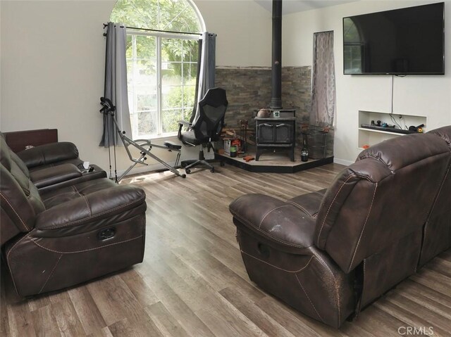 3687 Madison Dr, Clearlake, CA 95422 - living area featuring a wood stove and wood finished floors