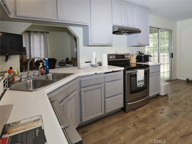 3687 Madison Dr, Clearlake, CA 95422 - kitchen featuring stainless steel electric stove, under cabinet range hood, dark wood-style flooring, gray cabinets, and light countertops