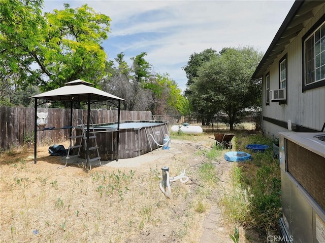 3687 Madison Dr, Clearlake, CA 95422 - fenced backyard featuring a gazebo and cooling unit