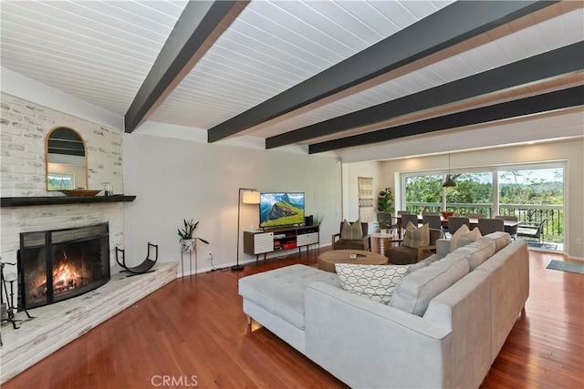 394 Emerald Dr, Lake Arrowhead, CA 92352 - living area with beam ceiling, a fireplace, and wood finished floors