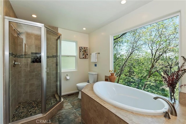 394 Emerald Dr, Lake Arrowhead, CA 92352 - bathroom with a bath, a shower stall, recessed lighting, and stone finish floors