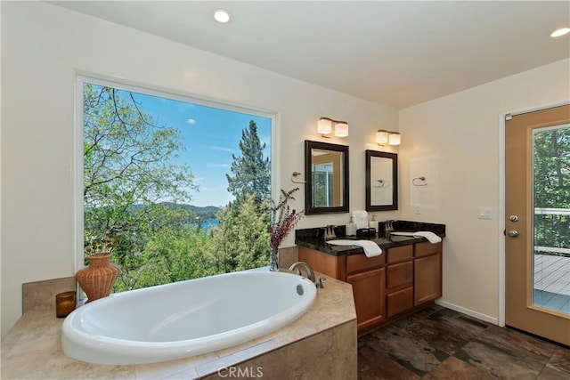 394 Emerald Dr, Lake Arrowhead, CA 92352 - bathroom featuring vanity, a bath, and recessed lighting