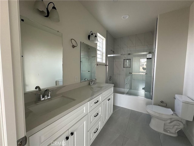 5215 Peony Ct, Riverside, CA 92506 - bathroom featuring double vanity, shower / bath combination with glass door, and tile patterned flooring