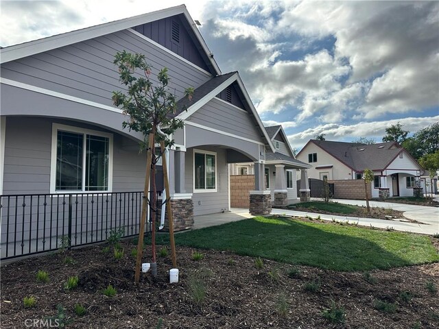 5215 Peony Ct, Riverside, CA 92506 - view of front of property with board and batten siding and covered porch