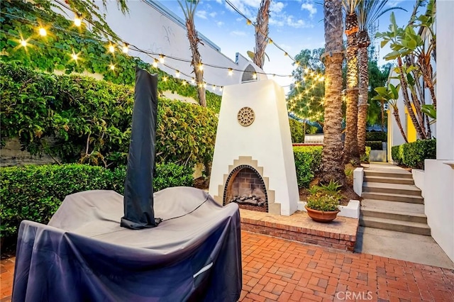 1749 Grand Ave Unit 4, Long Beach, CA 90804 - view of patio / terrace with an outdoor brick fireplace