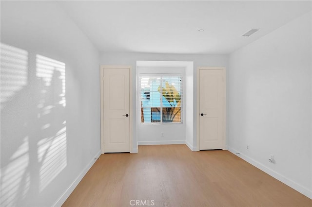 1749 Grand Ave Unit 4, Long Beach, CA 90804 - unfurnished bedroom with light wood finished floors and baseboards