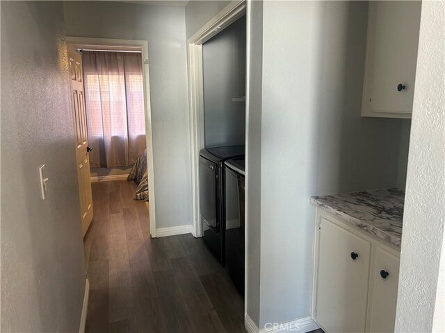 2258 El Rio St, Lancaster, CA 93535 - corridor with dark wood-style flooring and washing machine and dryer