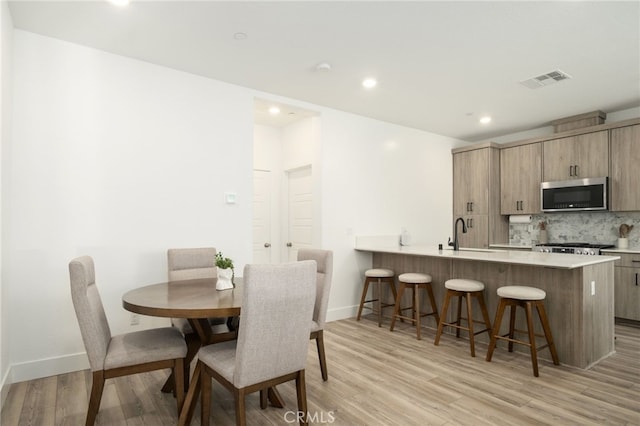 480 W Balsam Ln, Clovis, CA 93611 - dining area with light wood-type flooring and recessed lighting