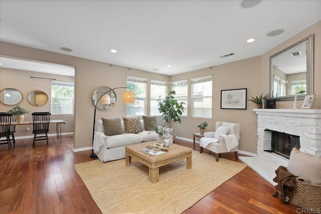 15809 Concord Rdg, San Diego, CA 92127 - living area featuring dark wood finished floors, recessed lighting, and a stone fireplace