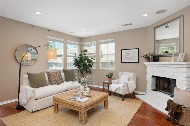 15809 Concord Rdg, San Diego, CA 92127 - living area featuring wood finished floors, a stone fireplace, and recessed lighting