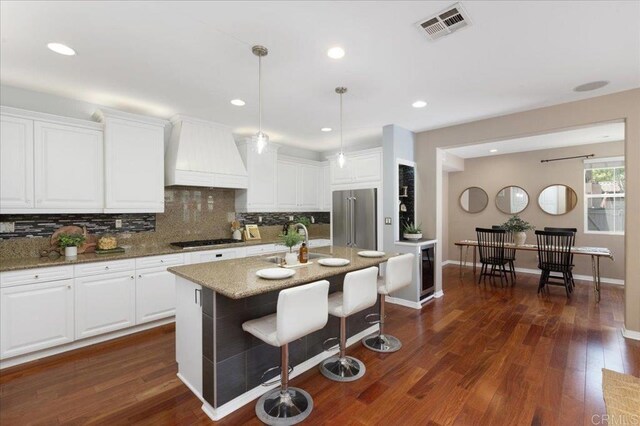 15809 Concord Rdg, San Diego, CA 92127 - kitchen with premium range hood, appliances with stainless steel finishes, backsplash, white cabinetry, and recessed lighting