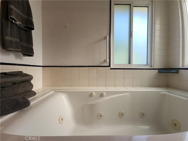 1150 W Santa Clara Ave, Santa Ana, CA 92706 - full bathroom with a jetted tub and decorative backsplash