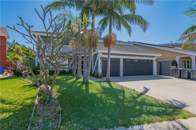2325 N Linwood St, Santa Ana, CA 92705 - view of front of house with driveway, an attached garage, stucco siding, and a front lawn