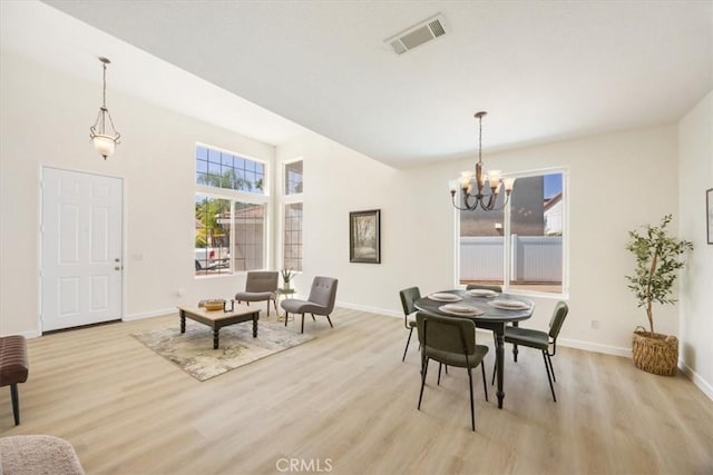 5444 Broderick Ct, Hemet, CA 92544 - dining area with a chandelier and light wood finished floors