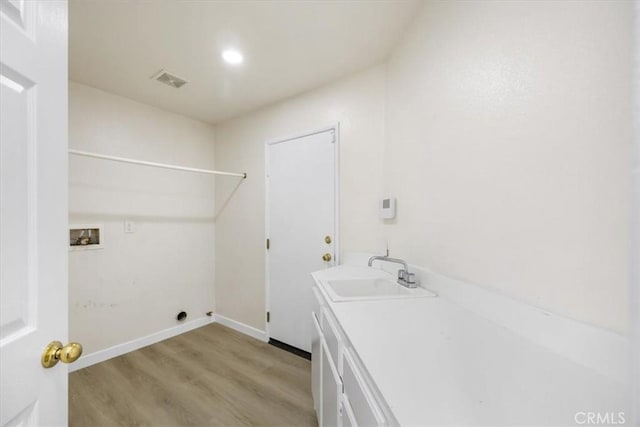5444 Broderick Ct, Hemet, CA 92544 - laundry area featuring washer hookup and light wood-style flooring