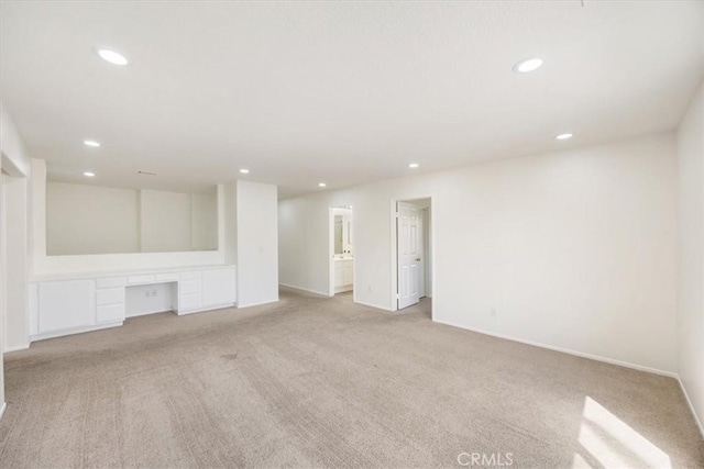 5444 Broderick Ct, Hemet, CA 92544 - unfurnished living room with recessed lighting, light carpet, and a desk