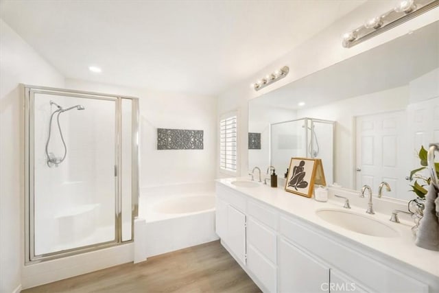 5444 Broderick Ct, Hemet, CA 92544 - full bath featuring a stall shower, a garden tub, double vanity, and wood finished floors