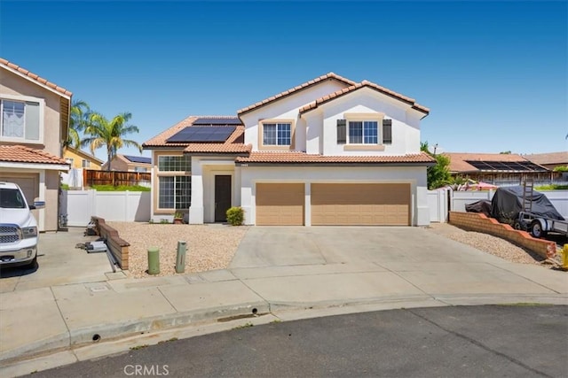 5444 Broderick Ct, Hemet, CA 92544 - mediterranean / spanish home with a garage, solar panels, stucco siding, concrete driveway, and a tile roof