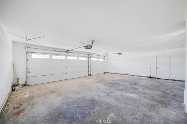 14225 Woodpark Dr, Moreno Valley, CA 92553 - garage featuring a garage door opener