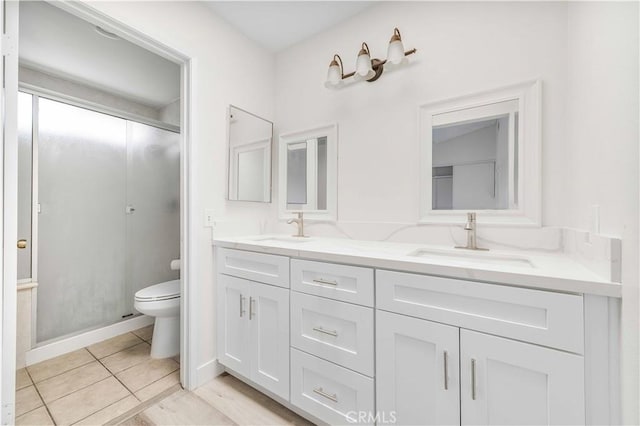 14225 Woodpark Dr, Moreno Valley, CA 92553 - bathroom featuring double vanity, a shower stall, and tile patterned flooring