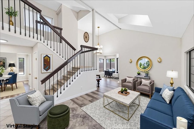 14225 Woodpark Dr, Moreno Valley, CA 92553 - living area featuring stairs, a skylight, high vaulted ceiling, and a chandelier