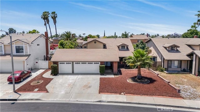 14225 Woodpark Dr, Moreno Valley, CA 92553 - view of front facade featuring concrete driveway, a tile roof, an attached garage, a residential view, and stucco siding