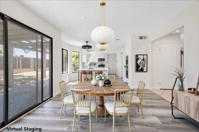 14225 Woodpark Dr, Moreno Valley, CA 92553 - dining room with light wood-style flooring