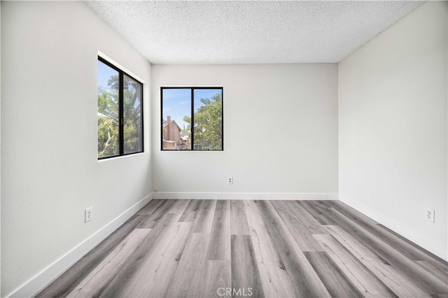 14225 Woodpark Dr, Moreno Valley, CA 92553 - unfurnished room featuring a textured ceiling and light wood finished floors