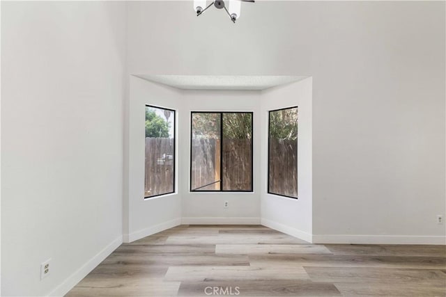 14225 Woodpark Dr, Moreno Valley, CA 92553 - unfurnished room featuring healthy amount of natural light and wood finished floors