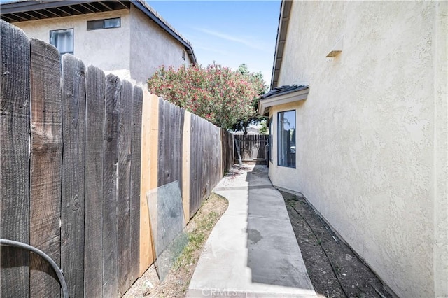 14225 Woodpark Dr, Moreno Valley, CA 92553 - view of property exterior featuring stucco siding and a fenced backyard