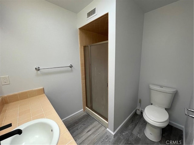1935 W Santa Ana Ave, Fresno, CA 93705 - bathroom featuring wood finished floors, a stall shower, and vanity