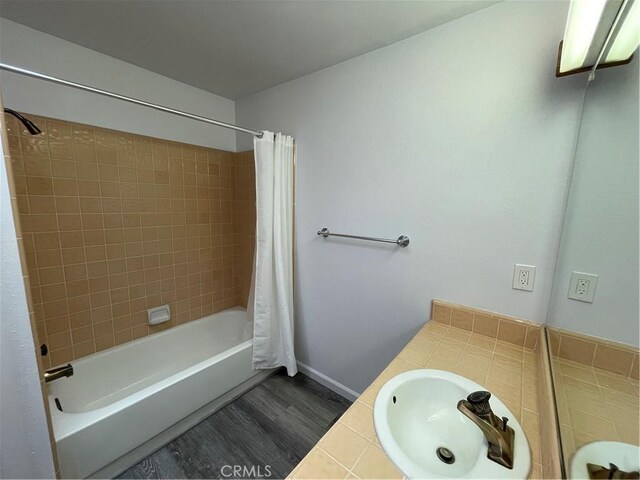 1935 W Santa Ana Ave, Fresno, CA 93705 - full bath featuring shower / bath combo, vanity, and wood finished floors