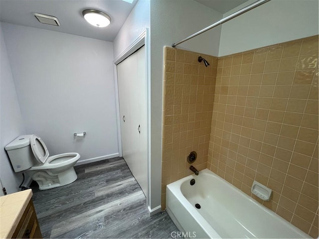 1935 W Santa Ana Ave, Fresno, CA 93705 - bathroom featuring wood finished floors, washtub / shower combination, and vanity