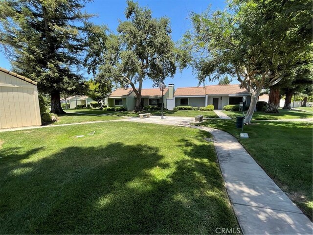 1935 W Santa Ana Ave, Fresno, CA 93705 - view of front of house with a front lawn
