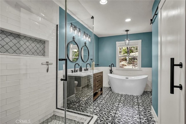 19072 Redbud Rd, Hidden Valley Lake, CA 95467 - full bath featuring tile walls, double vanity, a shower stall, a freestanding bath, and recessed lighting