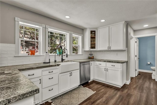 19072 Redbud Rd, Hidden Valley Lake, CA 95467 - kitchen featuring stainless steel dishwasher, tasteful backsplash, white cabinets, dark stone counters, and recessed lighting