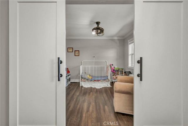 19072 Redbud Rd, Hidden Valley Lake, CA 95467 - bedroom with ornamental molding, a crib, and dark wood finished floors