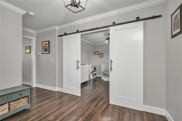 19072 Redbud Rd, Hidden Valley Lake, CA 95467 - corridor featuring a barn door, dark wood finished floors, and crown molding