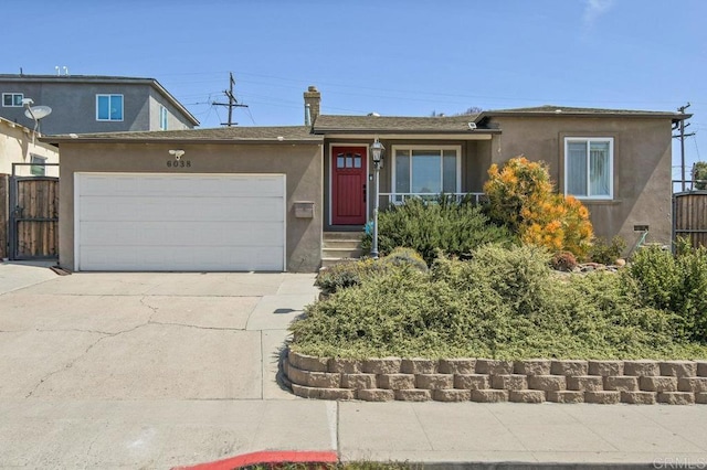 6038 Bradford St, San Diego, CA 92115 - view of front of house featuring stucco siding, concrete driveway, and a garage