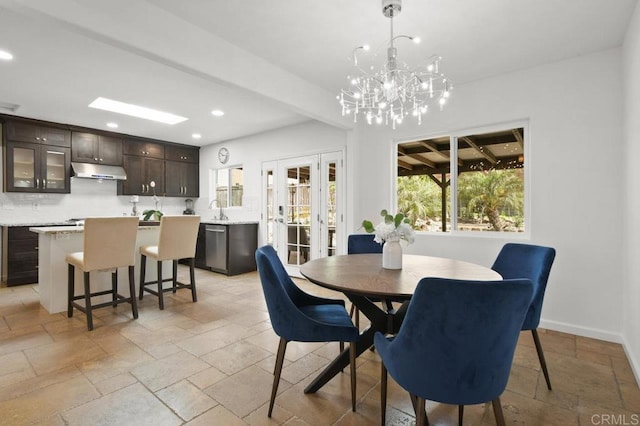 6038 Bradford St, San Diego, CA 92115 - dining space featuring stone tile flooring, recessed lighting, french doors, and a chandelier
